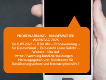 Plakat mit Smartphone zum bundesweiten Warntag